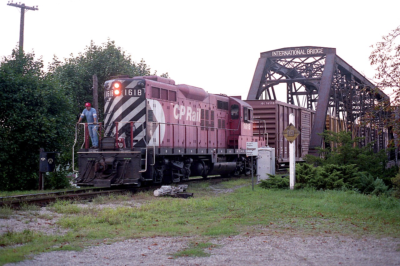 Although in years back I saw transfers from most roads out of Buffalo coming over to Canada, one glaring omission was seeing CP in Fort Erie. Only rarely did I see a CP switcher working down there. And I am wondering why. Was it a night move?
Here is CP 1618, which came down thru the CN yard to pick up some traffic. They backed their few cars onto the International bridge in order to get lined up for the main. Then it was down the tracks back to Welland Yard, I would assume.
The only other time I recall this operation was also just before sundown. The sun is below the trees in this shot and I only followed the train as far as CN Duff, about mile 3.  CP 1618 was retired in 2012.