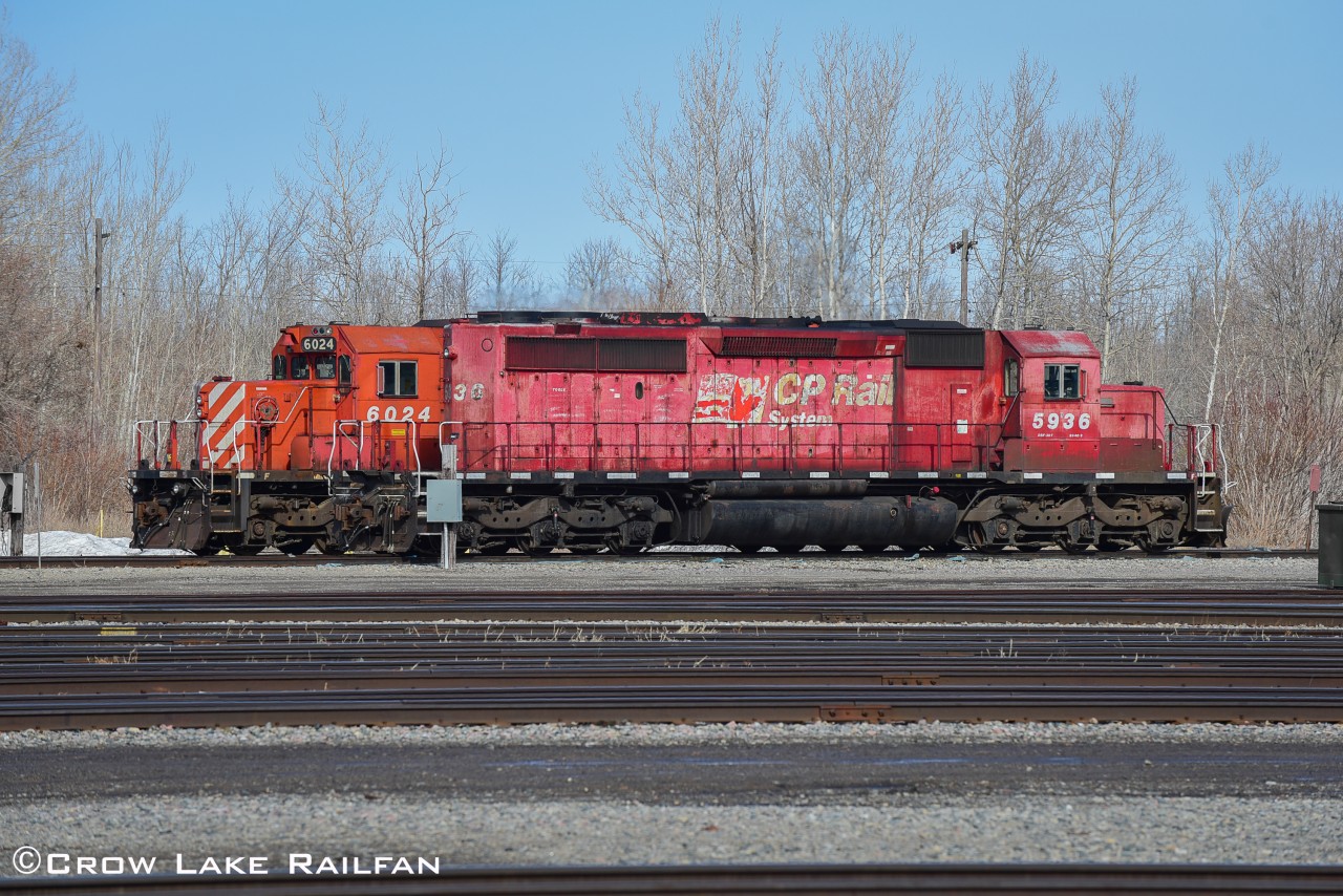 CP 5936 idles away in Smiths Falls after being dropped by 119 earlier in the week. CP 6024 is behind and was dropped off on a separate train a couple days prior.
The units would stay parked for a couple more days until they would be used to power yet another work train on the Winchester sub.
