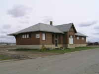 The CPR station in Vegreville is located about 2 blocks from the CNR station. Currently there are no tracks anywhere near it and it is currently being used as a bottle depot. The interior has been modified slightly, but a lot of the original features are still there. It's foot print is smaller than that of the local CN station.
Track wise, the the CPR Vegreville station was located at the south end of a branch that came down from the village of Willingdon AB. Only two railway related structures remain from the abandoned branch lines use. One is the Vegreville station and the other is grain elevator used by a local Warwick farmer. 