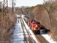 CP 118 heads east through mile 1.6 of the North Toronto in whatever remains of the morning sunlight around 11AM. They are about to pass under the Maclennan Avenue pedestrian bridge where I’m standing for this shot, a bridge which was constructed in the 60s originally after a grade crossing was removed, likely due to it being unsafe with the low visibility and high speed of trains, not to mention the fact that there were once a pair of crossovers here too.