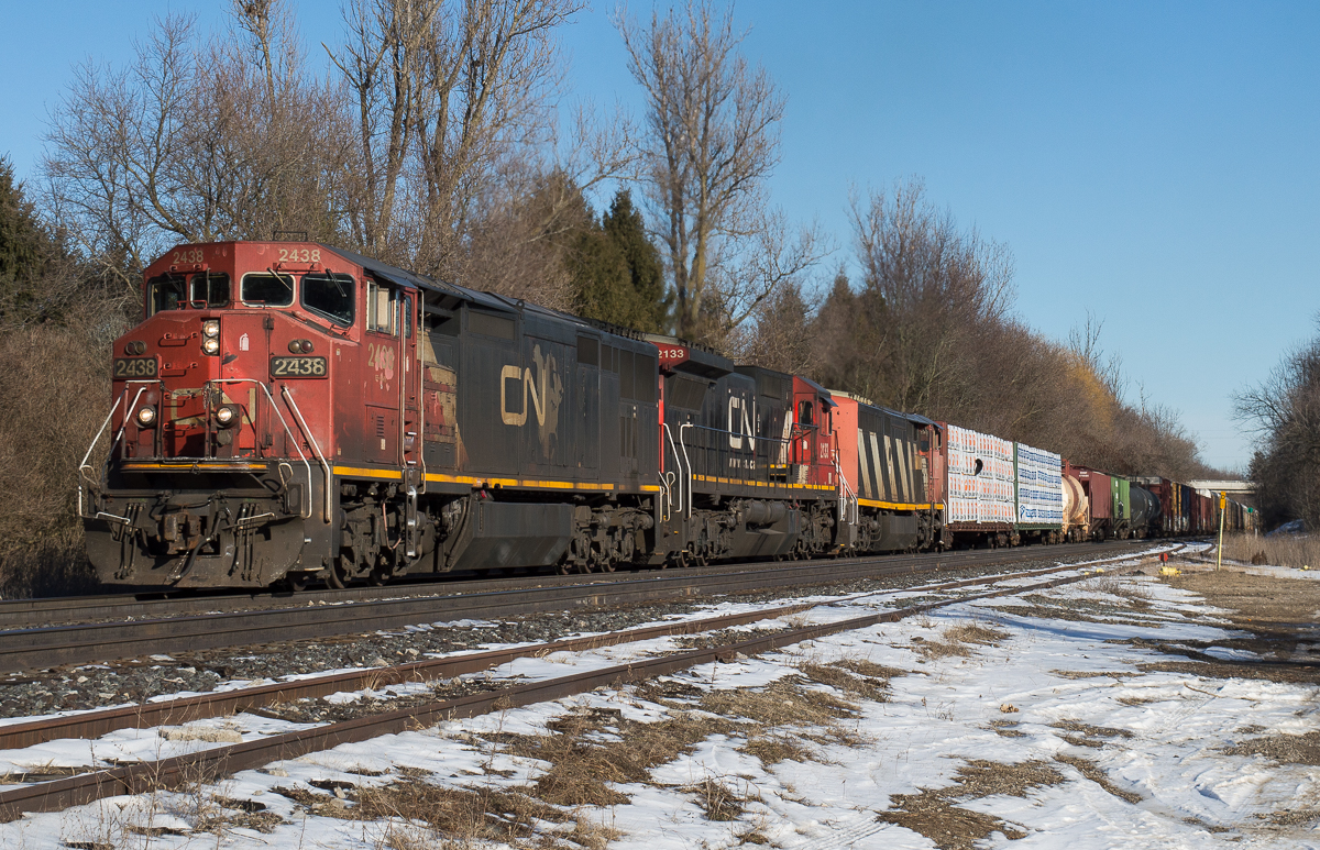 CN 435 grinds upgrade at Copetown behind a trio of Dash 8 variants.  CN 2438, CN 2133 and CN 2423 sounded great charging through Copetown on this sunny February afternoon.