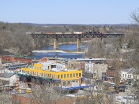 A short CN 148 scoots across the Grand River over echoing across the valley over the town of Paris.