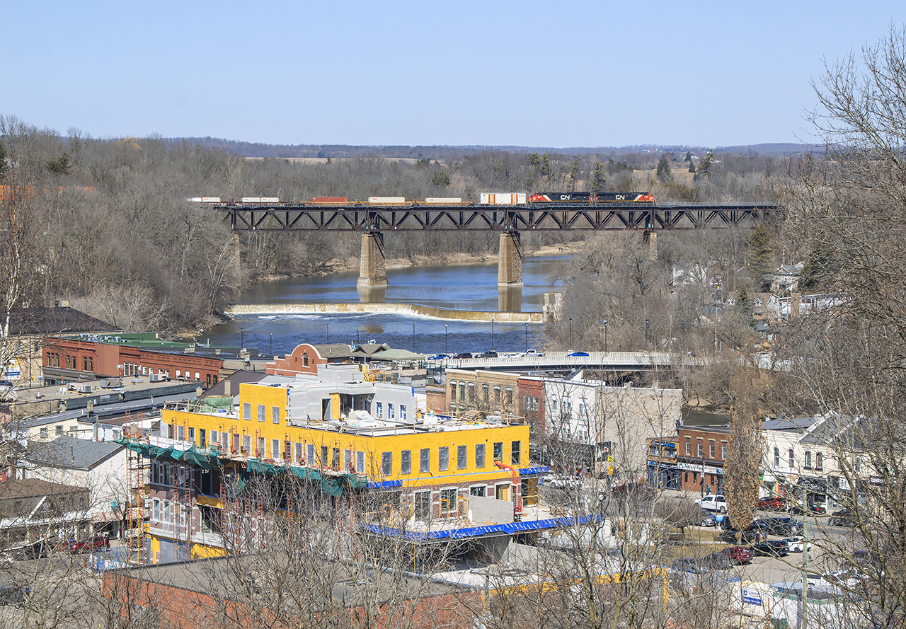 A short CN 148 scoots across the Grand River over echoing across the valley over the town of Paris.