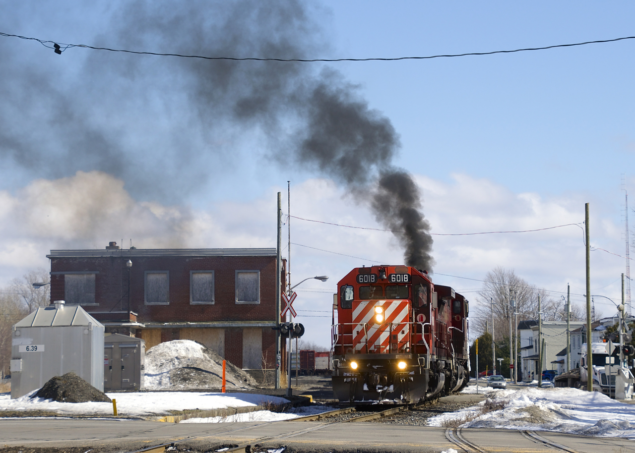 CP 251 is backing up past the out of use station at Farnham as the trailing GE smokes it up.