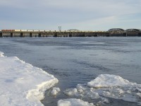 A pair of SD60M's (CP 6258 & CP 6262) lead CP 251 over the St. Lawrence River a bit before sunset.
