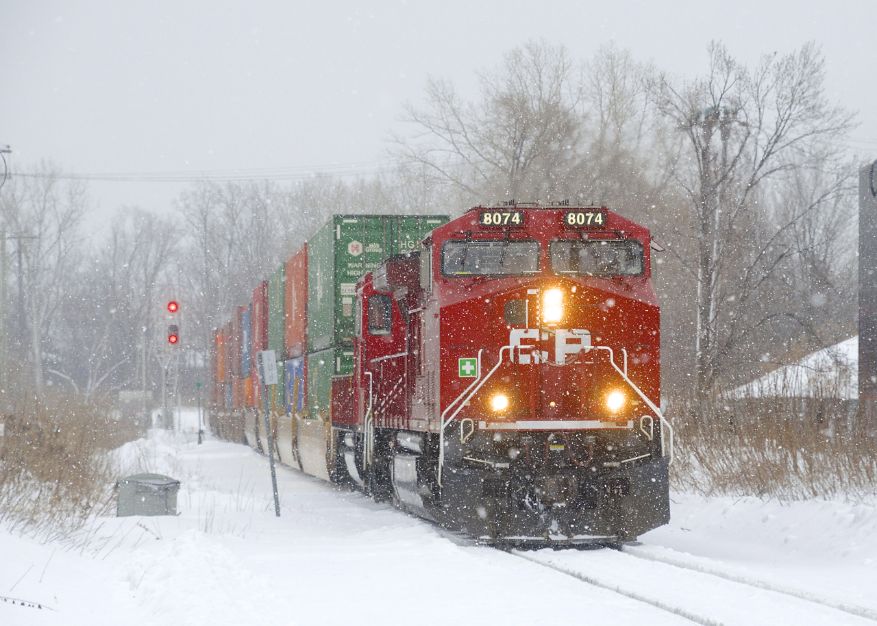 CP 112 with CP 8074 & CP 2252 up front (as well as CP 8046 mid-train and CEFX 1002 on the tail end) has just left the Vaudreuil Sub as it heads towards Lachine IMS Yard on a snowy morning.
