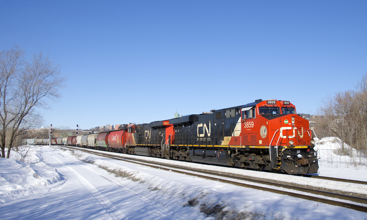 With some older hoppers up front, CN 878 is heading for the Port of Montreal with CN 3859 and CN 2851 for power.