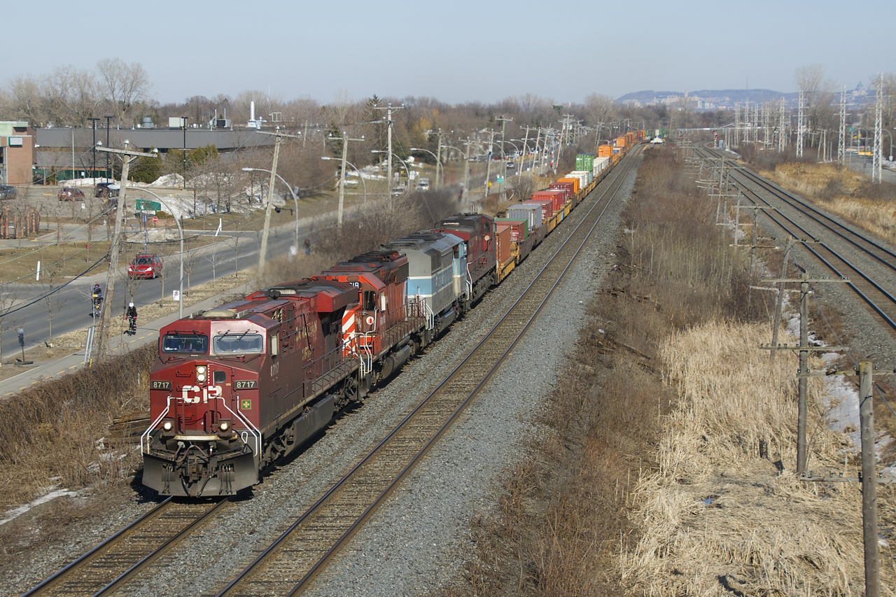 CP 143 has CP 8717, CP 6018, CMQ 9011 & CP 8548 for power as it heads west with a train of stacks and autoracks. The EMD units will be dropped at Smiths Falls to be power for a rail train.