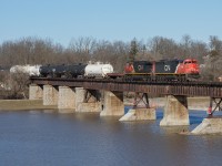CN A402 crosses the Grand River in Caledonia with CN 2415 leading the way.  A later than usual departure time from London and daylight savings yielded some great light from the side of the bridge that I shot from.  Having grown up in Caledonia photographing the SOR on their sporadic daylight runs, having a daily daylight CN train is a nice change of pace.