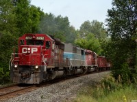 CP 5792 South leans into the bend at Mt St Louis road with a couple of ballast drops near Craighurst, enroute to the siding at Essa. As great as it was to hear a set of SD40-2's working on a heavy stone train, 5792 did seem to have an ominous "thud" or "popping" sound that could be heard from miles away for most of this summer, and has since been tied up unserviceable. 