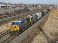 CN 327 is passing MP 14 of CN's Kingston Sub with CSXT 5383, CSXT 302 and 67 cars.