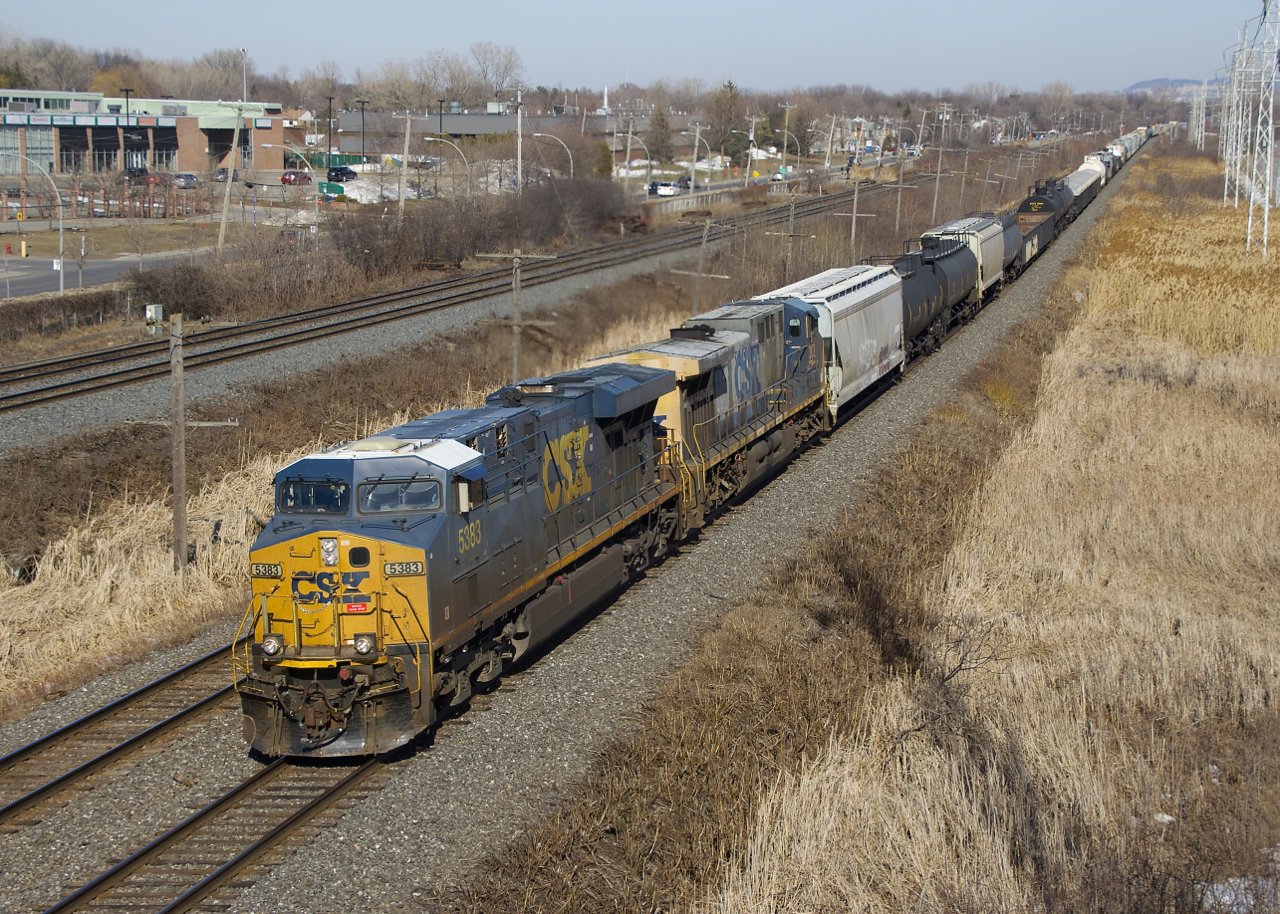 CN 327 is passing MP 14 of CN's Kingston Sub with CSXT 5383, CSXT 302 and 67 cars.