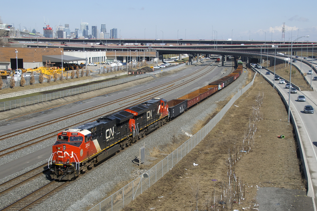 CN 321 has a pair of ET44AC's (CN 3245 & CN 3162) and 134 cars as it heads west. It will have to stop for a short time a bit further ahead to let VIA 67 overtake it. Up front are a cut of gondolas; very common on this train.