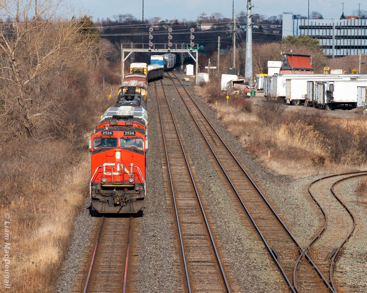 CN M321 heads west at mile 0.5 of the CN York Sub on a ridiculously windy afternoon. His train can be seen in the background snaking over the crossovers at Pickering Junction. This particular day I was out in hopes of catching BCOL 4618 leading an M369 but ran out of daylight as they had to stop and wait for 2 eastbounds to come off the York in the late evening hours. At least I saw some other trains I suppose!