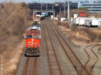 CN M321 heads west at mile 0.5 of the CN York Sub on a ridiculously windy afternoon. His train can be seen in the background snaking over the crossovers at Pickering Junction. This particular day I was out in hopes of catching BCOL 4618 leading an M369 but ran out of daylight as they had to stop and wait for 2 eastbounds to come off the York in the late evening hours. At least I saw some other trains I suppose!