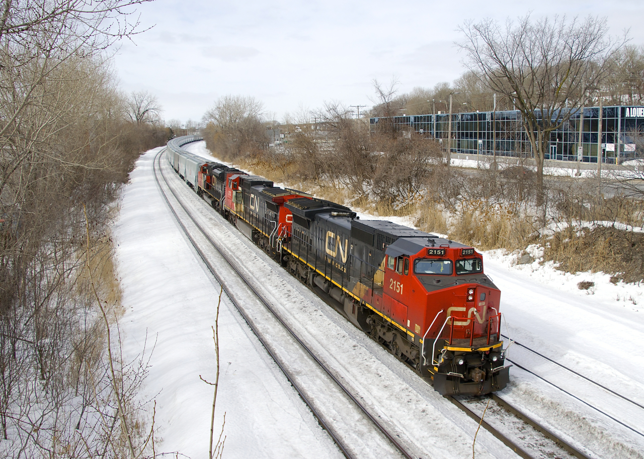 CN 874 is approaching Turcot Ouest for a crew change with CN 2151, CN 2172 & CN 8000 for power. The train consists of 99 grain cars for Bécancour, nearly all of them new CN hoppers.