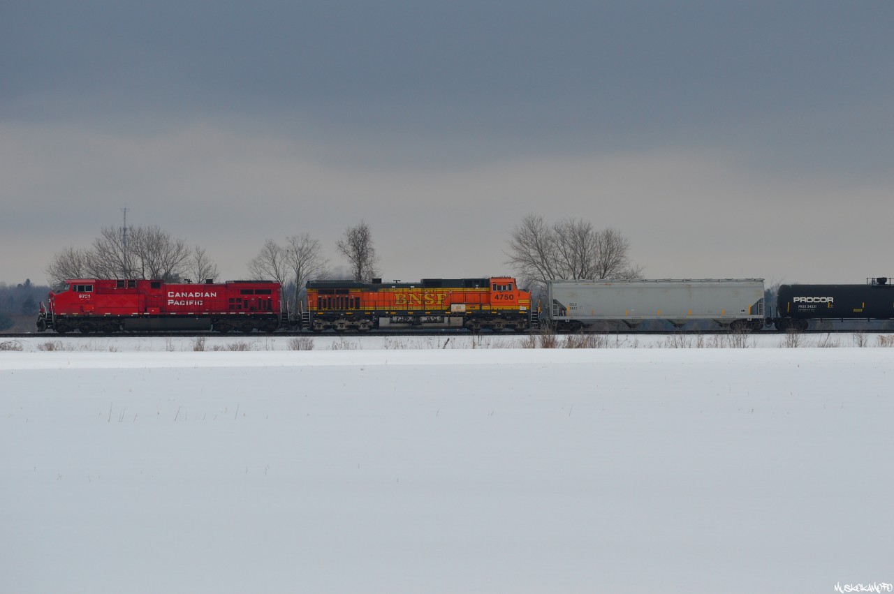 CP 9731 South leads ECAN "Winter Rail" grain train 332 through the open countryside just West of Barrie, an otherwise boring shot/miserable day better spent inside, I'm a sucker for that original H2 look...