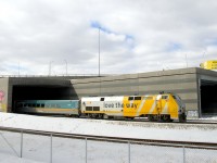 VIA 35 is mostly underneath the Turcot interchange as VIA 907 brings up its rear end. The tunnel it is passing through contains the south and north track of CN's Montreal Sub. The second tunnel behind it contains the freight track and track 29. In the foreground is the Turcot Holding Spur.