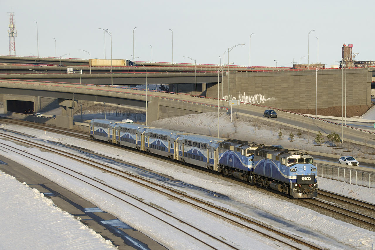 A pair of F59PH's (AMT 1349 & AMT 1344) lead EXO 1207 out from under the rebuilt Turcot interchange.