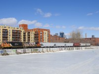 The Pointe St-Charles Switcher is shoving 6 grain cars towards the Ardent Mill, the last client remaining along the Lachine Canal. CN and CP once served dozens of clients along the canal, but the area has become increasingly gentrified.