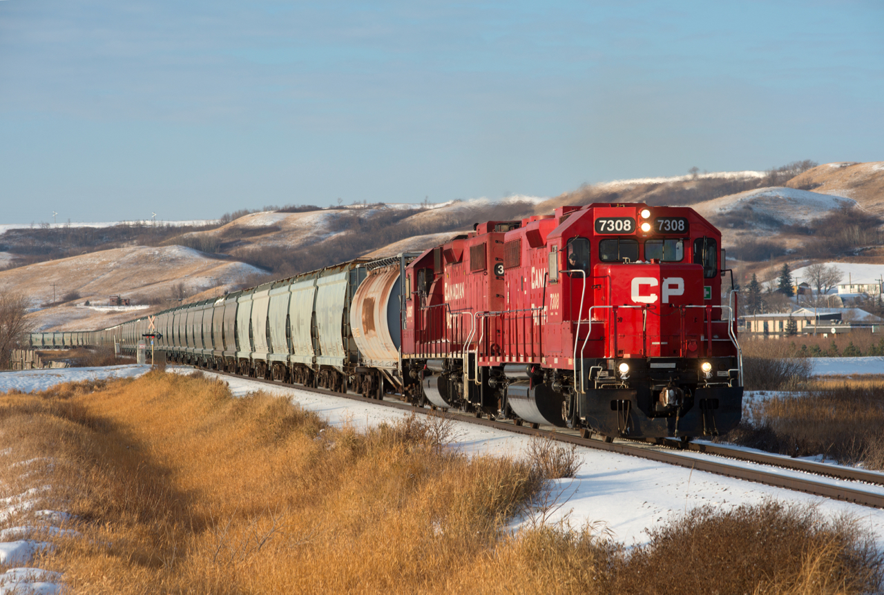CP N14 departs Craven Saskatchewan with a clean ex-STLH exx-D&H nee LV GP38-2 on the point.