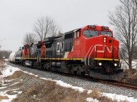 Not just another pair of CN GE's on a dull winter day.  Naturally, a noteworthy train runs in less than ideal weather conditions.  This is the first Sarnia - Garnet train 402 to operate, which is a new opportunity to photograph a "main line" train on the Hagersville Sub.  The train is photographed just east of Cainsville, ON, at the first of three crossings of Old Onondaga Road East.  The timing of the train should work out perfectly to get early-afternoon photographs of the train crossing the Grand River bridge in Caledonia.  Counterpart train 401, Garnet - Sarnia, will operate at night, based on the current schedule.  CN 2153, built as ATSF 836, is a long way from the Santa Fe transcon!  It's hard to believe these C40-8Ws have been on the CN roster for 10 years already.  Hopefully 401/402 will stick around awhile and yield some interesting consists; I'm looking forward to photographing at locations along the Hagersville Sub. that I haven't before, as well as seeing other's photos taken along the Hagersville Sub.  

