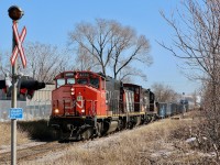 A decent mix of motive power adds some colour to the dormant scene as a CN local makes its way along the old N&NW spur on the way back to Hamilton yard after spending the morning deep in Hamilton's industrial core. 