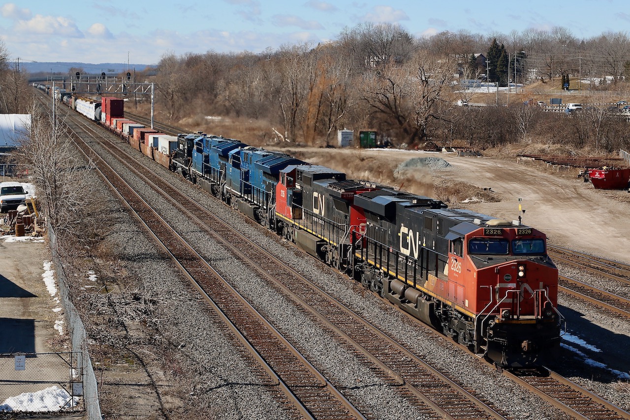 Even if the lighting wasn't the best, I certainly did not want to let this lash up get away without at least making an attempt on capturing it. CN 421/422 can certainly surprise one lately and today was no exception. Here GEVO 2326 leads a former BNSF/ATSF Dash-8, 2 demonstrator Tier4's GECX 2037 and 2038 ( not many of these left unrebuilt by CN) and JLCX 101, a former NS Genset, (interesting that when searching this unit online, JLCX 101 comes up as a GP9). The train is slowing to work Aldershot.
