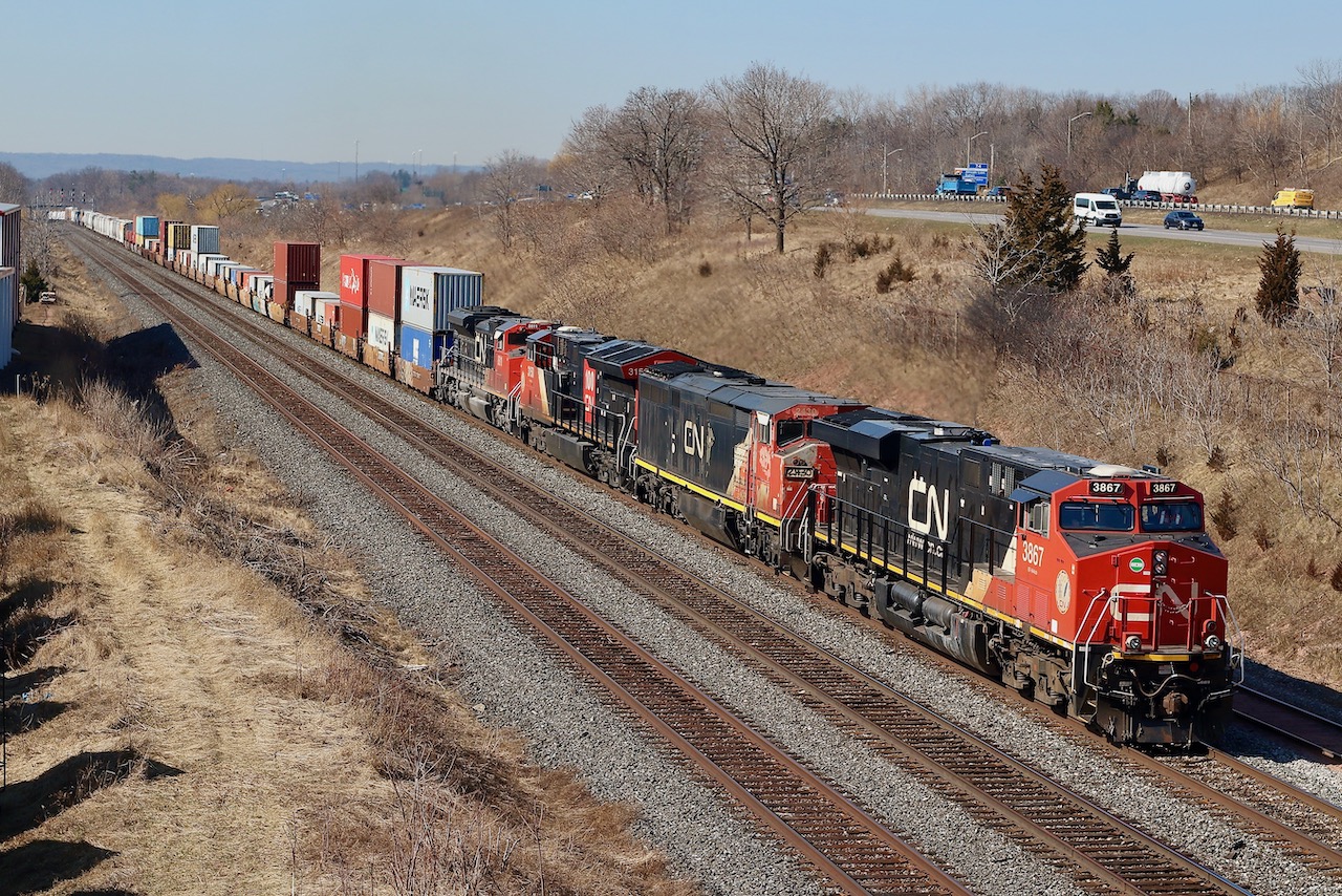 One of the more interesting trains lately around Southern Ontario has to be CN 422/421, often with at least a handful of units, not to mention DPU often on 421. Just about anything can show up on these trains depending on what is lingering in Toronto or Port Robinson. For the first full day of spring train 422 has a decent mix of power including a venerable Dash-8 in the form of 2430 with crude hand written number boards. Next stop for the train will be Aldershot yard before heading on to its destination of Toronto. The intermodal traffic is a common site these days as CN tries to build on intermodal traffic out of New York.