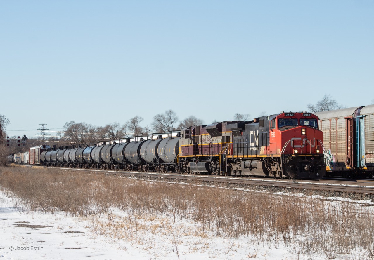 CN 2682 leads CP 244 on the approach to West Toronto where they will have to wait for a GO Train to clear the Davenport Diamond.