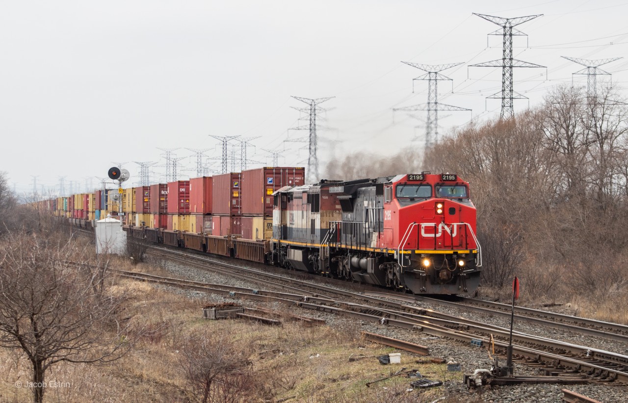 CN Z148 passes through the default signals just West of the Weston Road overpass with CN 2195 in the lead, an ex-ATSF C40-8W as well as BCOL 4611 trailing reversed.