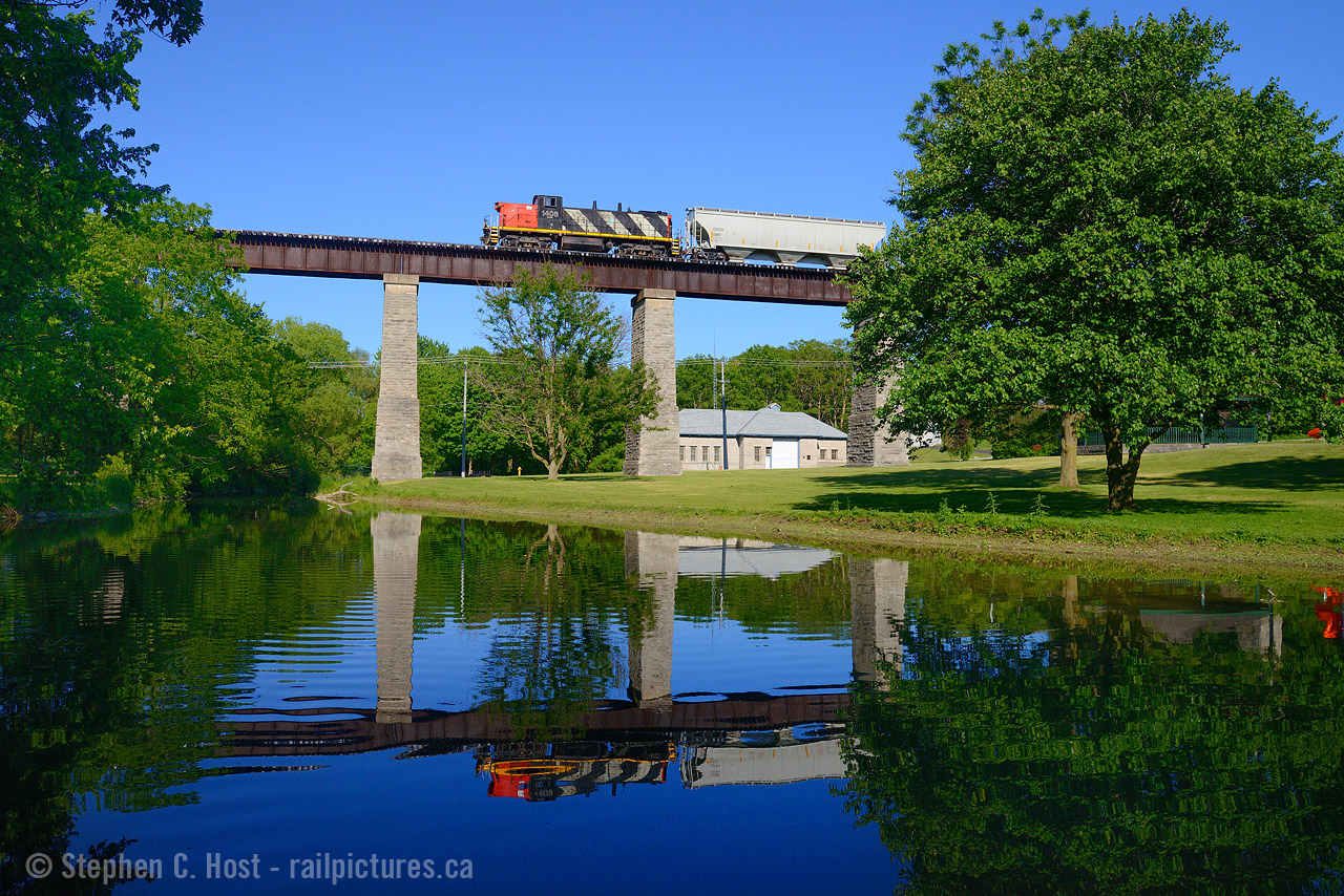 Welp, that's all folks. In better days, CN 1408 had the mainline all by itself as it led L568 from Kitchener to London and back, here seen crossing eastward on the Guelph subdivision.  Crossing over False Creek, itself joining the Thames River just to the west, you'd not realize in less than a year 1408 would be retired for good. Looks like the end has come for our GMD-1's - we'll see how much longer the remaining few last...
Source: Railfan & Railroad: http://railfan.com/canadian-national-purges-fleet-of-unique-gmd-1-locomotives/