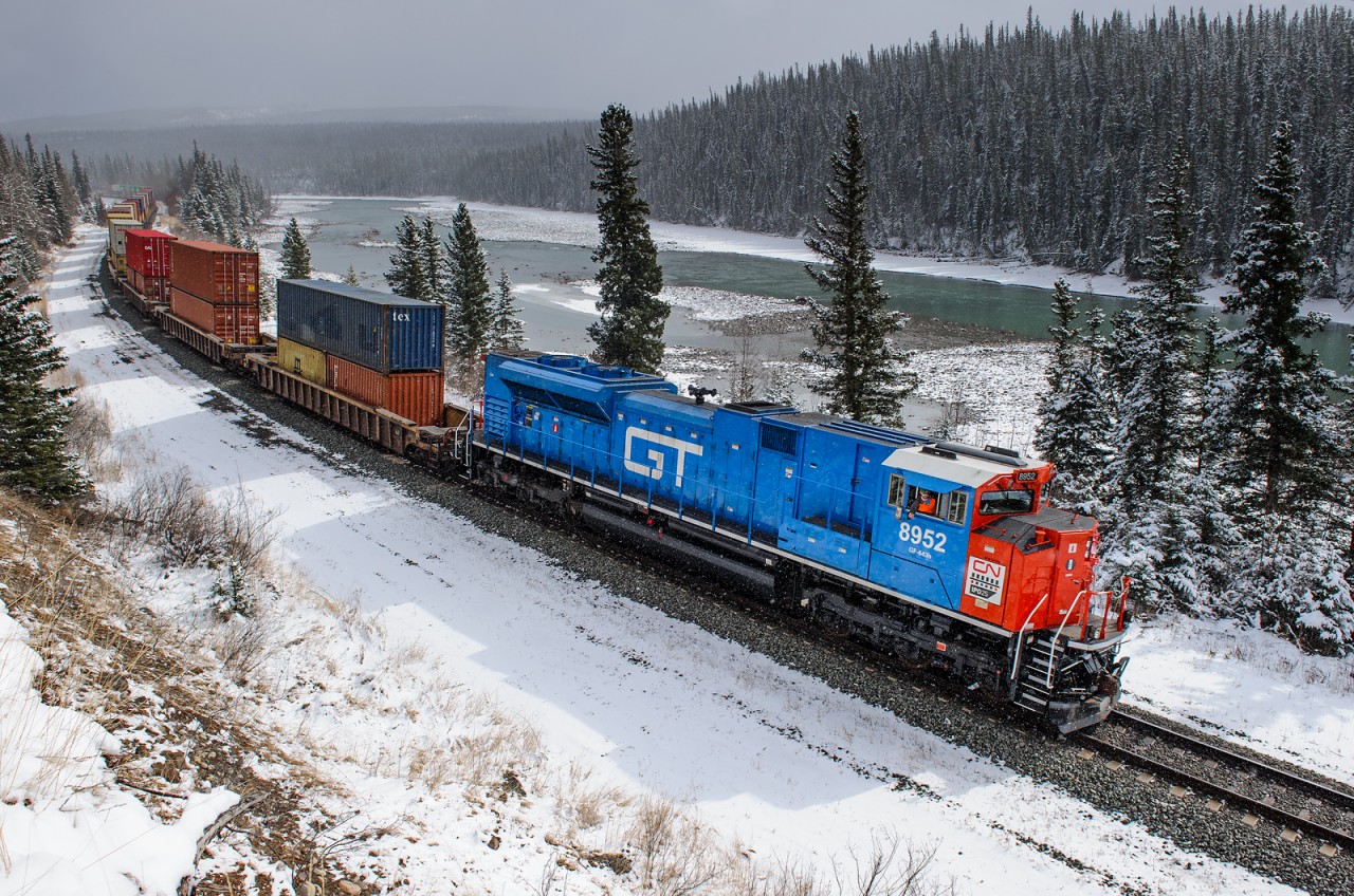 Painted in GTW blue and red, CN SD70M-2 8952 leads CN train Q19991 21 west on the Edson Sub between Solomon and Swan Landing. The sun decided to come out at a bad time, but I think it'll do!
