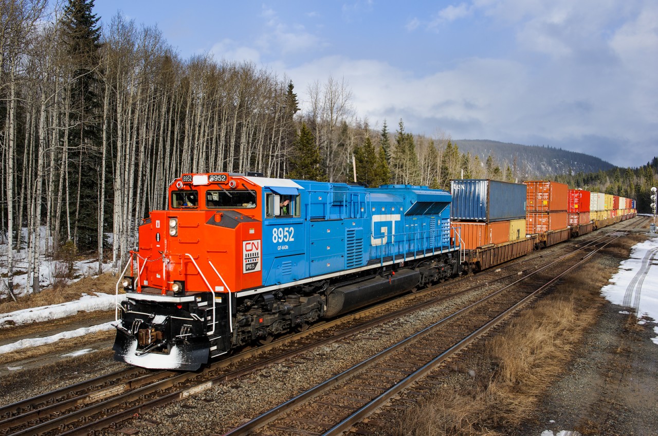 Q199 tips over the Continental Divide at Yellowhead, BC with CN SD70M-2 8952 leading, painted in GTW heritage livery.