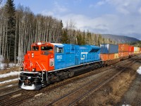 Q199 tips over the Continental Divide at Yellowhead, BC with CN SD70M-2 8952 leading, painted in GTW heritage livery.