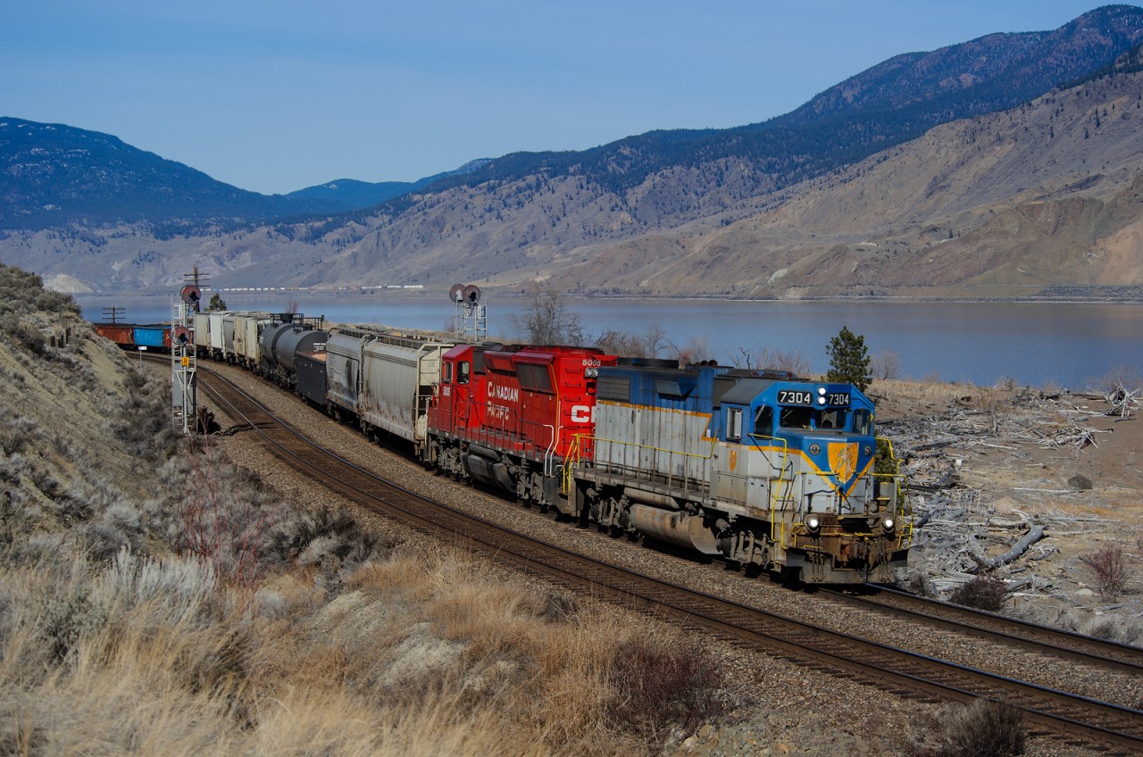 DH GP38-2 7304 has been assigned to Kamloops, BC during the last few weeks. I happened to be in town and noticed it broke free from the yard job and watched it head west towards Ashcroft, BC on train V52-11, the Ashcroft Wayfrieght, in the early AM. Knowing it would be back east in decent light, I set up between Munro and Cherry Creek on the Thompson Sub at Mile 15.9.