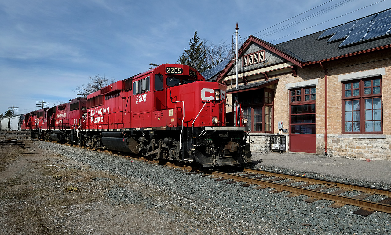 CP Rail train T08 rolls past Peterborough station on its way to Havelock and then up the 20 mile long Nephton Subdivision to Blue Mountain where it will service the nepheline syenite mine.  Power is a pair of GP20C- ECO’s and a GP38-2.  Peterborough station, built in 1884 by the O&Q Rwy, is one of the earliest CPR stations in Canada still on its original site.