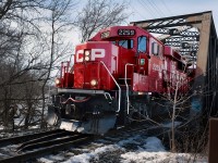On a fine late winter morning, an eastbound CP Rail freight train rolls across the bridge over the Otonabee River in central Peterborough this morning on its way to the Nephton mine north of Havelock.  Three locomotives, led by GP20C-ECO 2259, provide the power.