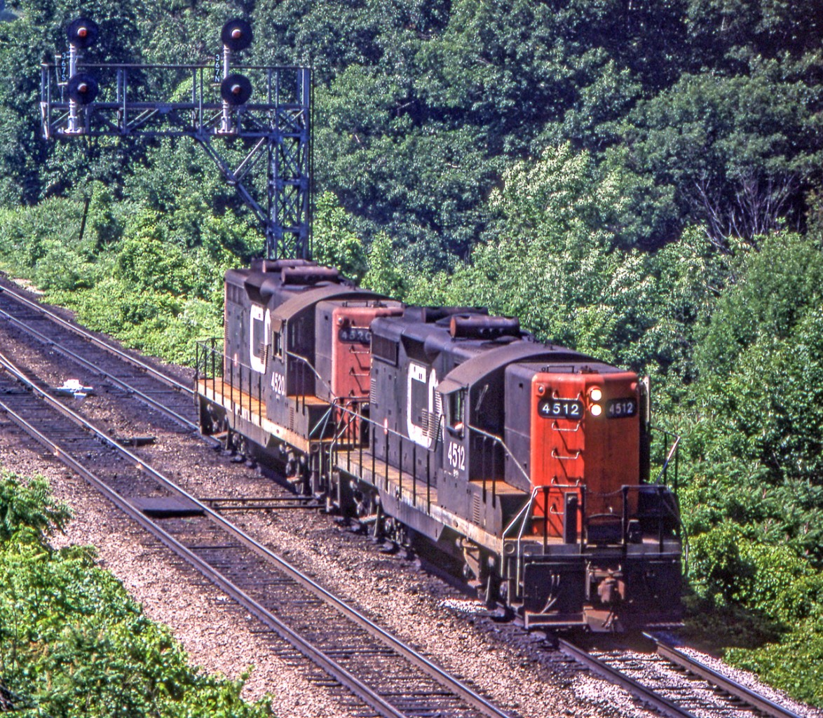 CN 4512 and CN 4520 are eastbound leaving Bayview Junction on July 2, 1981.