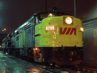 <br>
<br>
  Some fresh paint and light rain can highlight details....
<br>
<br>
  MLW 1959 built ex CN FPA-4  #6785 is resplendent in the new VIA livery...
<br>
<br>
  at CN Spadina, December 7, 1980 Kodachrome by S.Danko
<br>
<br>
