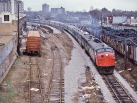 <br>
<br>
  VIA Rail train #5   Super Continental   is minutes out of Union, first stop is  CN St. Clair West
<br>
<br>
  North of Parkdale, January 26, 1980 Kodachrome by S.Danko
<br>
<br>
  Notable: that painted nose on GMD FP9A #6519 appears to be a quick attempt to erase the noodle.
<br>
<br>
  Third car is an ex CP Chateau in crew dormitory service
<br>
<br>
  Shocking:
<br>
<br>
  The  VIA Super Continental  disappeared from VIA timetables effective November 15, 1981, replaced by daily (un-named) service:
<br>
<br>
		sleeper equipped trains #7 & #8  Capreol – Winnipeg;  
<br>
<br>
		coach trains #109 & #110  Winnipeg – Regina – Saskatoon;
<br>
<br>
		Budd car trains #681 & #682  Saskatoon – Edmonton;
<br>
<br>
		the  sleeper equipped   Skeena   trains #9 & #10  Edmonton – Jasper – Prince Rupert 
<br>
<br>
		and VIA service on CN between Winnipeg and Saskatoon? And Jasper and Kamloops? You were on your own !
<br>
<br>
  sdfourty
