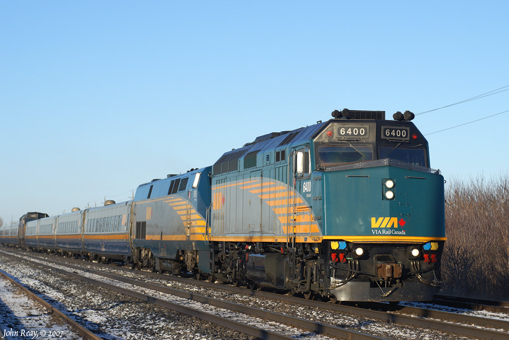 The first VIA F40PH-2 to be rebuilt and upgraded. This unit's apprearance differed from the subsequent rebuilds. Seen here leading J-train 52/40 at Cobbledick Road, Newcastle, ON (CN Clarke East, Kingston sub) on February 23rd, 2007. The unit was wrecked just over 3 years later on February 25th, 2010 and retired soon thereafter.