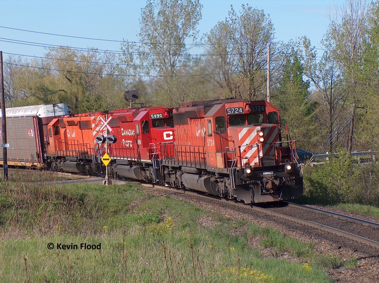 A westbound CP autorack train is pictured climbing Orr's Lake Hill at the west end of Cambridge on a pleasant spring afternoon. Power was CP 5724-5990-592x. Happy Easter everyone!