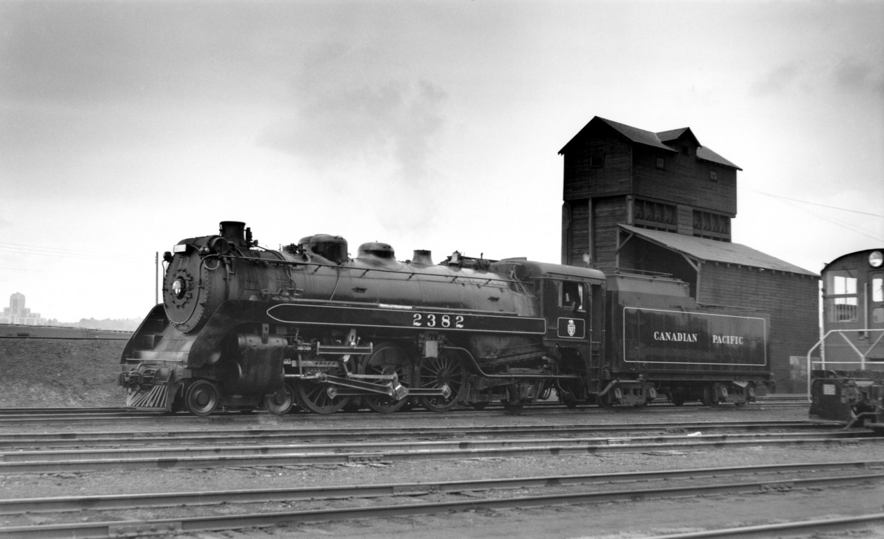 CP 2382 at Drake street yard, one of the first G3 class to replace the G4a class engines in passenger service on the coast (Vancouver to Revelstoke).  Vancouver city hall visible at left.
