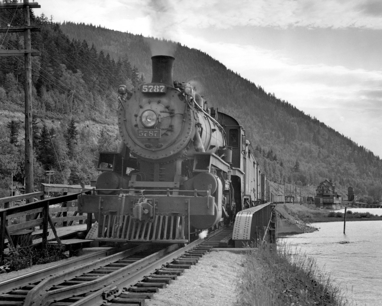 CP 5787 on second 952 with 29 cars on Sicamous narrows bridge.  Sicamous station/hotel visible in distance.