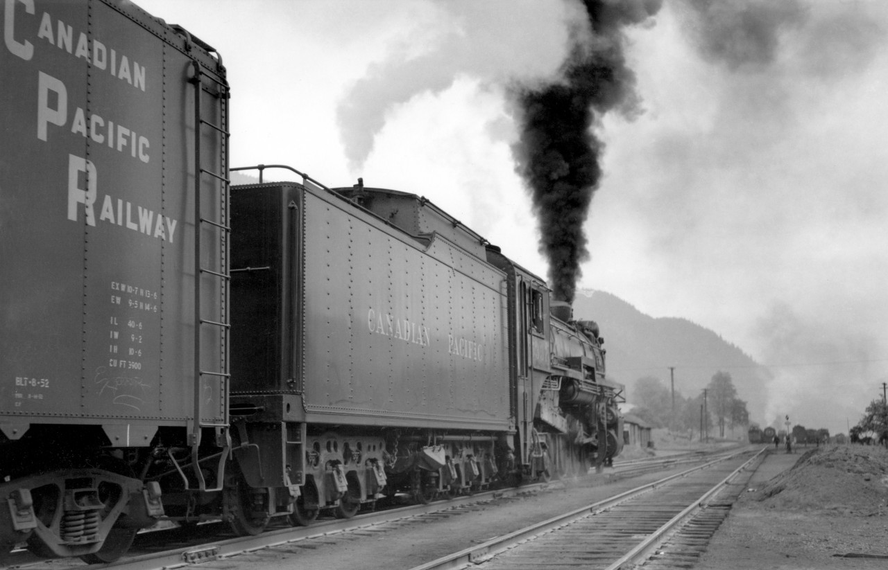 Moments after previous shot, as drivers slip, hogger lets out sand as engine drags into North Bend.