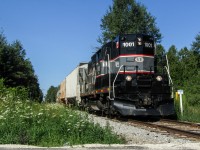 BCRY 1001 passes the siding at Colwell with a few hoppers and a tanker headed for industries in Innisfil. At the time, the siding was being used to store tankers due to the downturn of traffic caused by COVID-19.