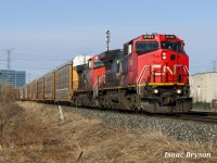 CN 271 hauls westbound approaching 14th Avenue in Markham with an old Ex-Santa Fe relic! Formerly ATSF 812, CN 2141 has spent its life running on the ATSF, BNSF, and CN with a fairly uncommon RS3K horn. As of the date of the shot, it could quite possibly be the last CN unit to showcase this type of horn. While it is now fouled (one of the bells is dead), it was still nice to hear the horn blast through the south end of Markham ON.