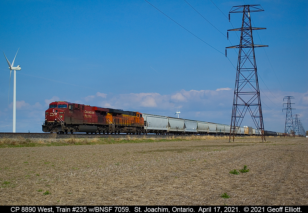 While waiting on CN 439 to arrive, I was informed of a CP westbound approaching Tilbury.  Since I was close to the CP main I figured I'd head on over and see what was up.  CP train #235 approaches St. Joachim with CP 8890 leading BNSF 7059 in nice light for a change on a beautiful April 17th, 2021 afternoon.  Now back over to catch CN #439.....  :-)