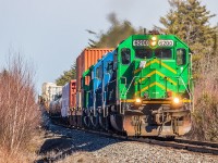 NBSR 6200 leads westbound NBSR train 907 as they descend down the grade at Cork, New Brunswick. 